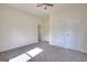Cozy bedroom featuring a double door closet, neutral paint, and carpet flooring at 6316 Rockland Rd, Lithonia, GA 30038