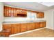 The Eat-in kitchen features wood cabinets, granite-look counters, and vinyl flooring at 6316 Rockland Rd, Lithonia, GA 30038