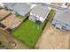 Aerial view showcasing the house's backyard with a large lawn and a playset at 4365 Sunflower Cir, Cumming, GA 30040