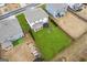 Aerial view of the home featuring a spacious backyard, patio, and playset at 4365 Sunflower Cir, Cumming, GA 30040