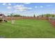Spacious backyard with a lush lawn and playset, perfect for outdoor activities at 4365 Sunflower Cir, Cumming, GA 30040
