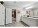 Modern bathroom with granite counters, white cabinetry, and tile floors, providing a clean and contemporary feel at 4365 Sunflower Cir, Cumming, GA 30040