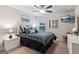 Cozy bedroom features a ceiling fan, natural light, and contemporary decor at 4365 Sunflower Cir, Cumming, GA 30040