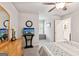 Relaxing bedroom featuring soft lighting, a ceiling fan, and comfortable decor at 4365 Sunflower Cir, Cumming, GA 30040