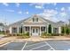 Well-maintained clubhouse with covered entryway, manicured landscaping, and convenient parking at 4365 Sunflower Cir, Cumming, GA 30040