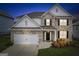 Charming two-story home with well-maintained lawn and landscaping features a two car garage at 4365 Sunflower Cir, Cumming, GA 30040