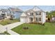 Charming two-story home with well-maintained lawn and landscaping features a two car garage at 4365 Sunflower Cir, Cumming, GA 30040