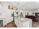 Bright, eat-in kitchen features stainless steel appliances, granite counters, and an island with bar seating at 4365 Sunflower Cir, Cumming, GA 30040