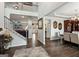 Open-concept space with wood floors, staircase, and view of formal dining and living area at 4365 Sunflower Cir, Cumming, GA 30040