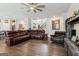 Open-concept living room with hardwood floors, ceiling fan, lots of space, and comfortable seating at 4365 Sunflower Cir, Cumming, GA 30040