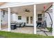 Cozy covered patio with an outdoor furniture set, grill, and swing, great for entertaining guests outdoors at 4365 Sunflower Cir, Cumming, GA 30040