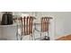 Kitchen with white cabinets, stainless steel appliances, and bar seating with ornate chairs at 109 Bowen Cir, Atlanta, GA 30313