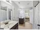 Bathroom with double sinks, wood cabinets, tile floors and shower/tub combo at 605 Camano Way, Mcdonough, GA 30253