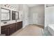Spacious bathroom boasting double sinks with a separate soaking tub at 605 Camano Way, Mcdonough, GA 30253