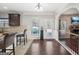 Bright breakfast nook with hardwood floors, a water cooler, and access to the living area and back patio at 605 Camano Way, Mcdonough, GA 30253