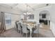 Elegant dining room featuring coffered ceilings, a large table, and stylish chandelier at 605 Camano Way, Mcdonough, GA 30253