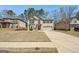Charming two-story brick home with a manicured lawn, and attached two car garage at 605 Camano Way, Mcdonough, GA 30253
