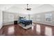 Spacious main bedroom with hardwood floors, ceiling fan, and large windows at 605 Camano Way, Mcdonough, GA 30253