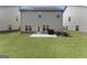 Spacious backyard with lush green grass, a patio area, and well-maintained landscaping at 2458 Walker Dr, Hampton, GA 30228
