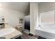 Well-appointed bathroom featuring a tub with shower and stylish decor elements at 2458 Walker Dr, Hampton, GA 30228