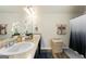 Elegant bathroom with double sinks, granite countertops, and stylish fixtures at 2458 Walker Dr, Hampton, GA 30228