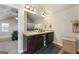 Bathroom featuring double sinks, spacious countertops, and well-placed lighting at 2458 Walker Dr, Hampton, GA 30228