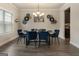 Dining room showcases elegant decor, stylish light fixture, and seating for six at 2458 Walker Dr, Hampton, GA 30228