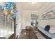 Bright foyer with wood-look floors, decorative wreath on the front door and lots of natural light at 2458 Walker Dr, Hampton, GA 30228