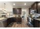 Bright kitchen with granite counters, stainless steel appliances, and easy access to dining and living areas at 2458 Walker Dr, Hampton, GA 30228