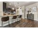 Open kitchen with granite countertops, stainless appliances, and bar seating at 2458 Walker Dr, Hampton, GA 30228