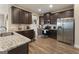 Well-equipped kitchen with stainless steel appliances, granite countertops, and dark cabinetry at 2458 Walker Dr, Hampton, GA 30228