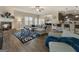 Open-concept living room boasts a fireplace, cozy seating, and hardwood floors at 2458 Walker Dr, Hampton, GA 30228