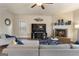 Inviting living room with fireplace, hardwood floors and large television for entertaining at 2458 Walker Dr, Hampton, GA 30228