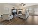 Spacious living room featuring hardwood floors, a cozy fireplace, and comfortable seating at 2458 Walker Dr, Hampton, GA 30228