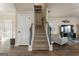 Inviting stairway with carpeted steps, wood trim, and natural light enhancing the home's interior at 2458 Walker Dr, Hampton, GA 30228
