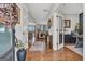 Inviting foyer with hardwood floors leading to an open-concept living area with views of the outdoors at 8110 Brewton Bnd, Cumming, GA 30028