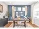 Well-lit home office with a large desk, stylish decor, and a neutral color scheme for a productive workspace at 8110 Brewton Bnd, Cumming, GA 30028