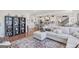 Open-concept living room flows into a modern kitchen with stainless steel appliances and stylish decor at 8110 Brewton Bnd, Cumming, GA 30028