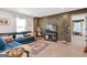 Cozy living room with comfortable blue sofa, decorative pillows, and stylish decor at 8110 Brewton Bnd, Cumming, GA 30028