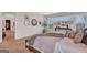 Another view of the stylish main bedroom showcasing large windows and tasteful decor at 8110 Brewton Bnd, Cumming, GA 30028