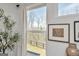 Window view with wooded outdoor scene, complemented by interior decor elements at 8110 Brewton Bnd, Cumming, GA 30028