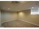 Finished basement with neutral walls, recessed lighting, and carpet flooring at 5784 Sharon Dr, Norcross, GA 30071