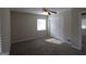 Bedroom with ceiling fan, large window and closet at 5784 Sharon Dr, Norcross, GA 30071
