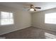 Inviting bedroom with a ceiling fan and natural light from the windows at 5784 Sharon Dr, Norcross, GA 30071