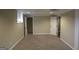 Bedroom with neutral walls and trim, standard closet, and carpet flooring at 5784 Sharon Dr, Norcross, GA 30071