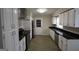 Well-equipped kitchen with modern appliances, sleek countertops, and ample cabinetry at 5784 Sharon Dr, Norcross, GA 30071