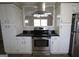 Modern kitchen boasts stainless steel appliances and stylish countertops at 5784 Sharon Dr, Norcross, GA 30071