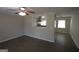 Open-concept living room featuring modern flooring and a kitchen view at 5784 Sharon Dr, Norcross, GA 30071