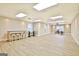 Spacious basement area with large windows, a workstation, and light vinyl floors at 165 Hideaway Dr, Fayetteville, GA 30215