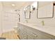 Bright bathroom showcasing a gray double vanity, black framed mirrors, and a white shower at 165 Hideaway Dr, Fayetteville, GA 30215